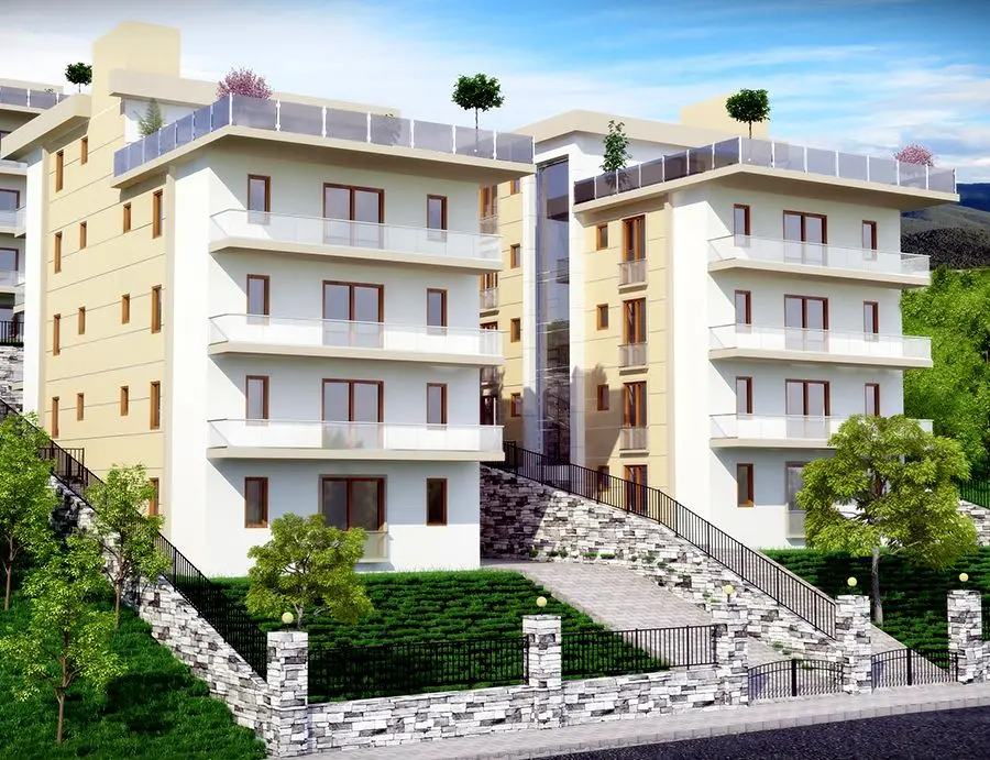 Eğimli arazide krem cepheli konut blokları ve taş duvarlar — 3D görselleştirme
